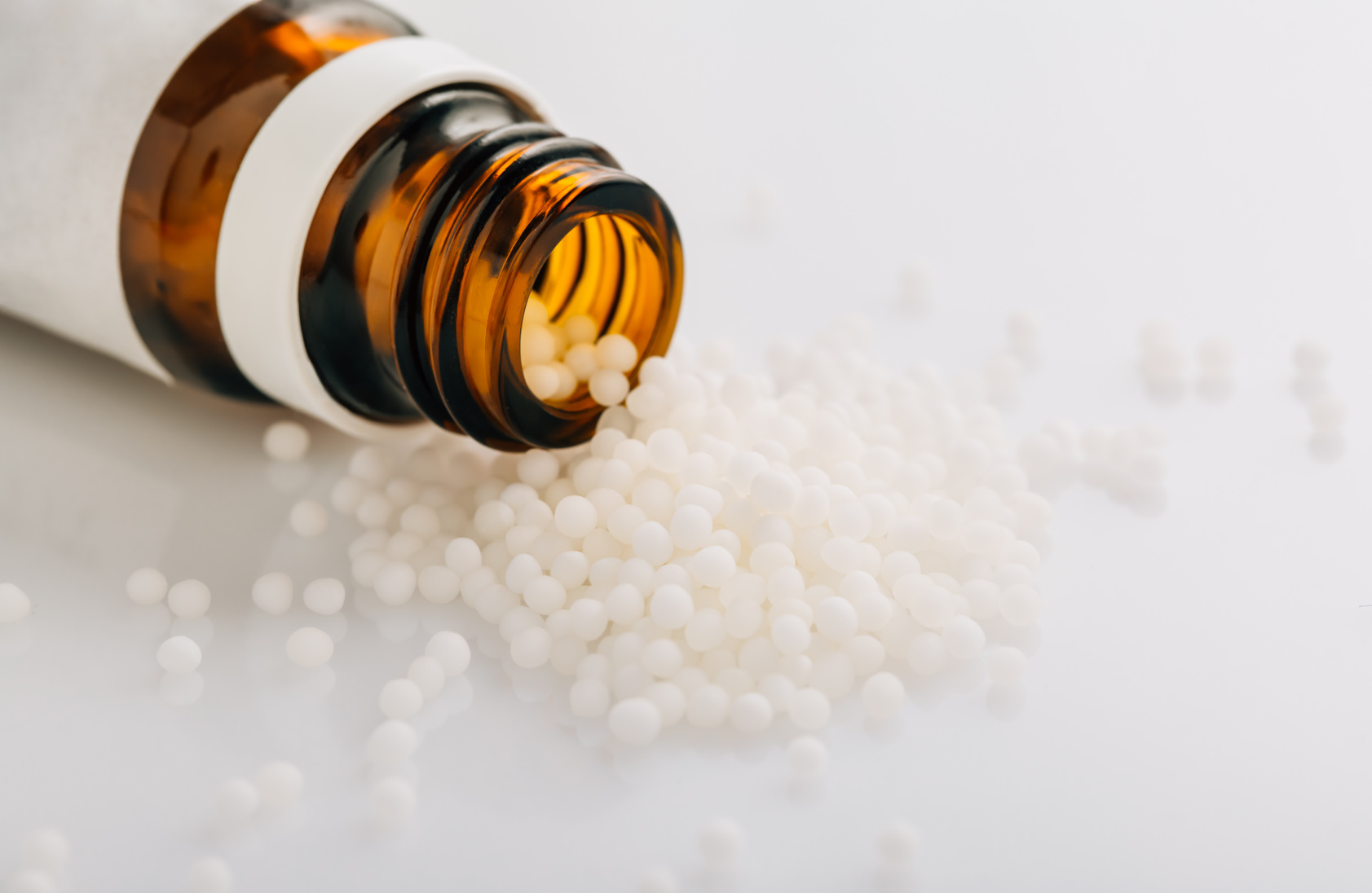 Homeopathic globules and glass bottle. Homeopathy, alternative medicine.