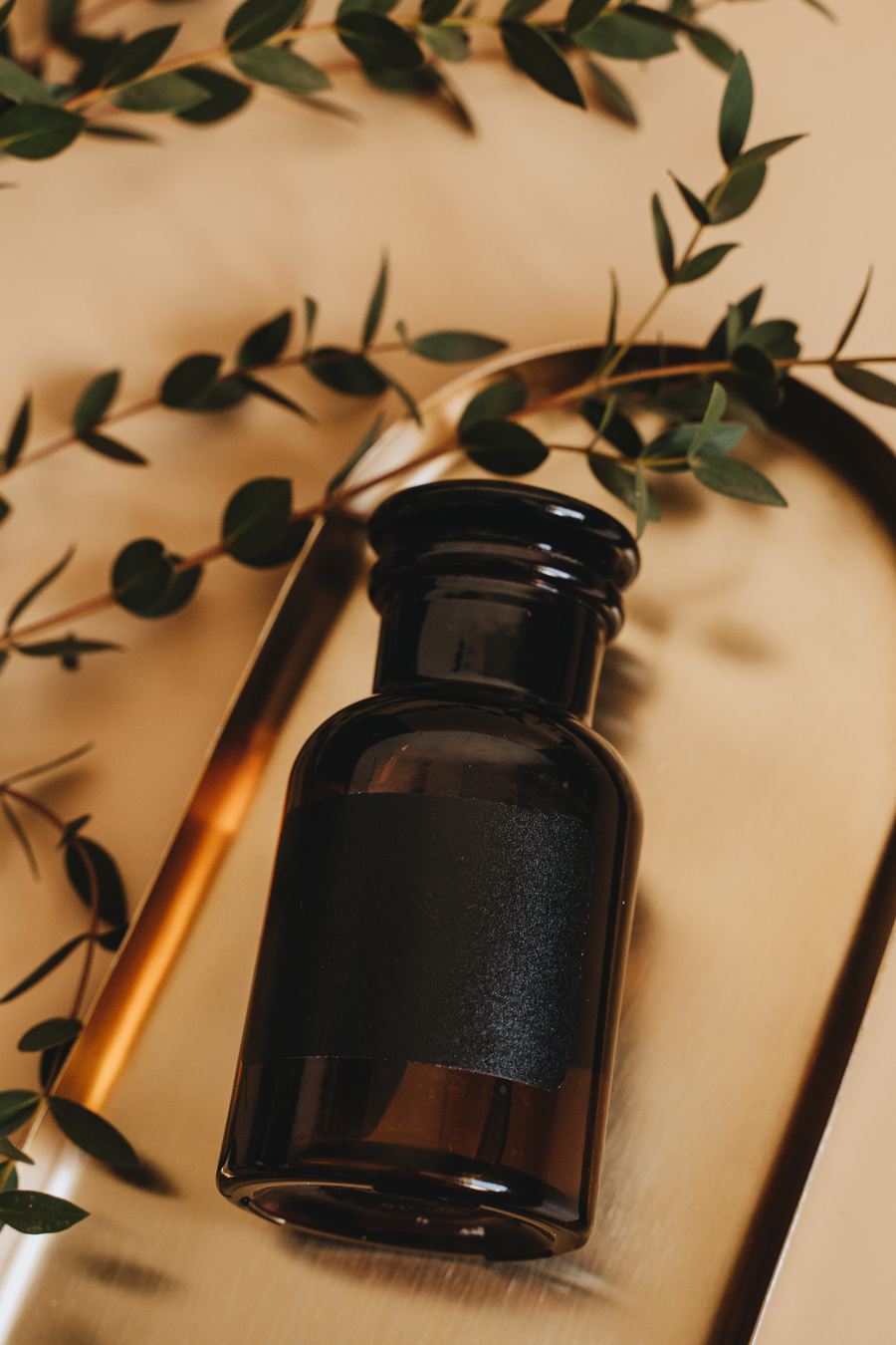 Brown Glass Bottle With Green Leaves